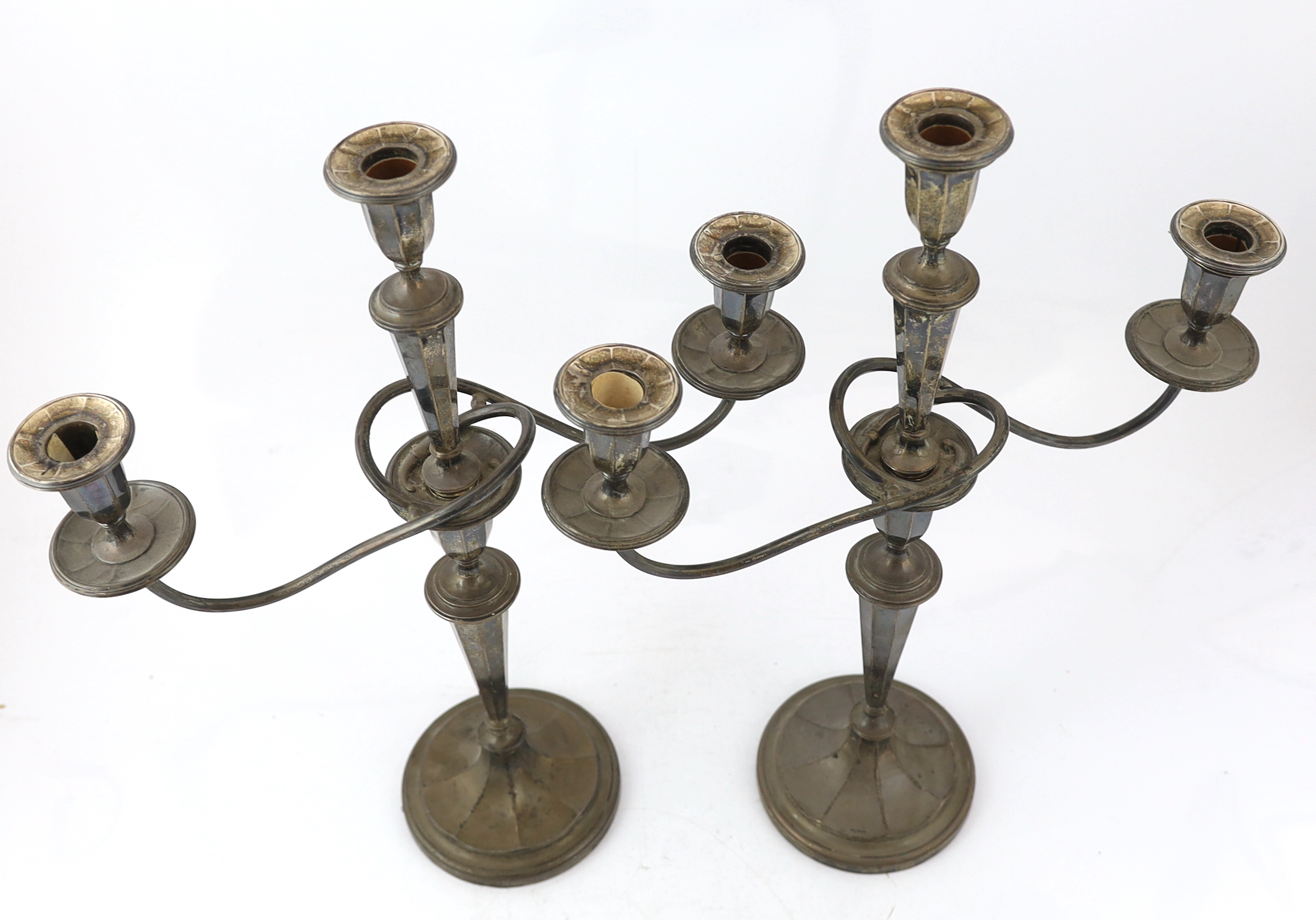 A pair of George V silver two branch, three light candelabra, by Eugene Leclere